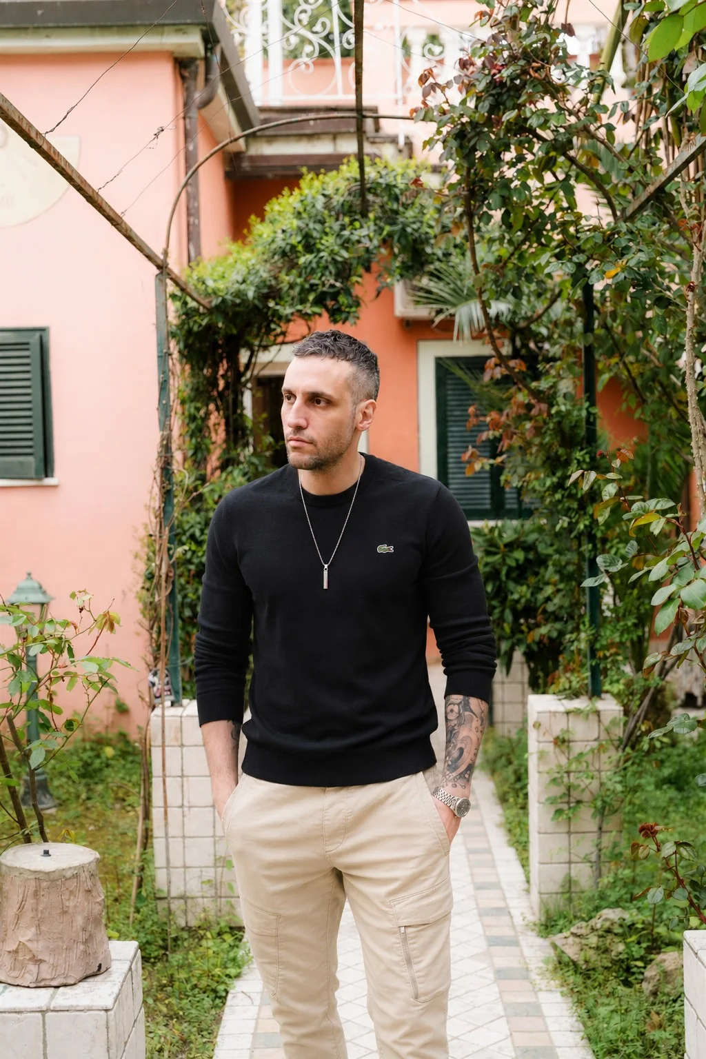 Michael standing outdoors in a quiet garden